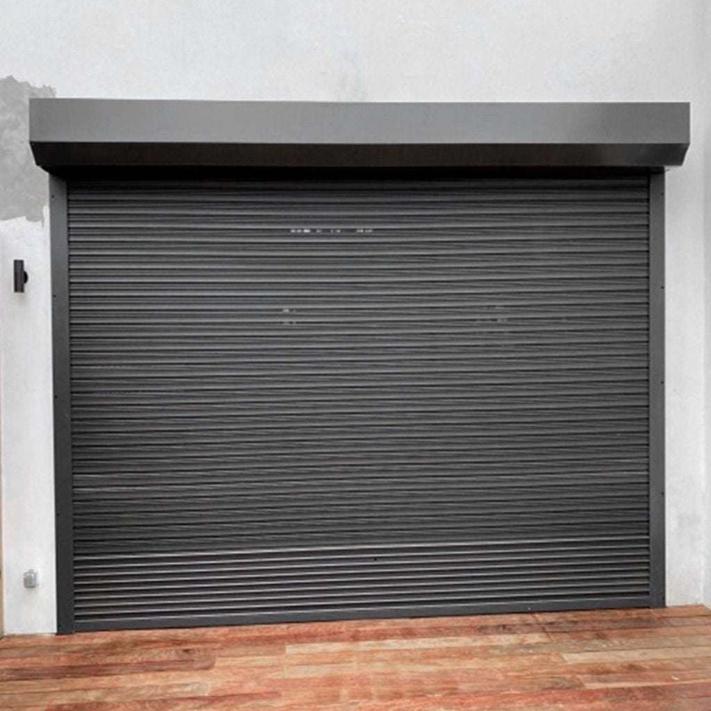 Dark gray roller shutter door on a building exterior