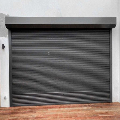 Dark gray roller shutter door on a building exterior
