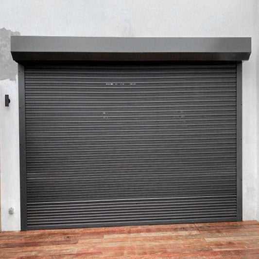 Dark gray roller shutter door on a building exterior
